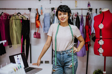 Portrait of latin fashion designer woman in workshop studio, Tailor boutique and retail creative small business in Mexico Latin America, hispanic people - obrazy, fototapety, plakaty