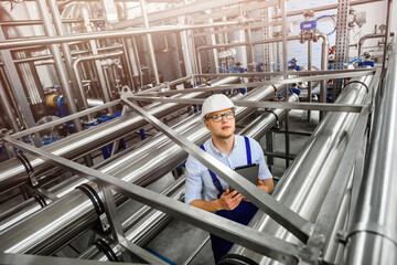 Top view of engineered metal structures of pipelines. Industrial plant for the treatment...