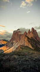 Fototapeta na wymiar Vertical shot of the beautiful Seceda and Dolomites mountains under the blue sky in South Tyrol