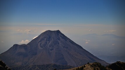 Aerial shot of the huge volcano in Guzman city Mexico against the blue sky
