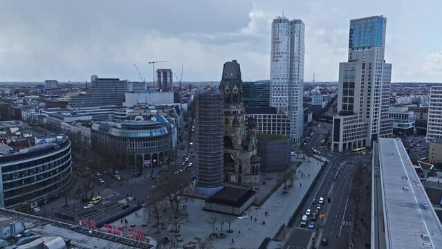 Drone shot of Kaiser Wilhelm Memorial Church ( Kaiser-Wilhelm-Ged&auml;chtnis-Kirche ) , Berlin on the Kurf&uuml;rstendamm in the centre of the Breitscheidplatz , Germany . 