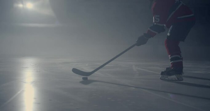 Closeup of a hockey player in an arena playing with a disk
