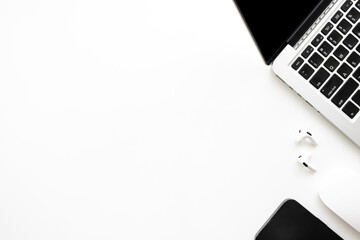 White office desk table with laptop computer and office supplies. Top view with copy spce, flat lay.