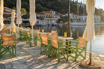 Cozy outdoor cafe in picturesque Kioni village in Ithaca island, Greece.