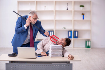 Old male boss and young male employee in bullying concept