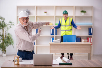 Two male architects working on the project