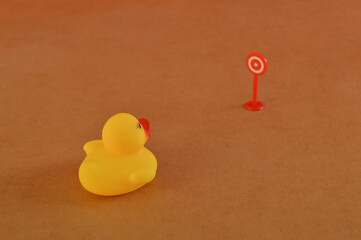 Toy duck heading to the target. Concept of achieving your goal