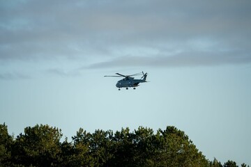 Fototapeta na wymiar Military helicopter landing in flight