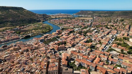 Aerial cityscape with a river on a sunny day