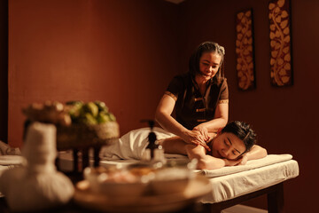 Relaxation Asian woman customer get service aromatherapy massage with masseuse in spa salon. - obrazy, fototapety, plakaty