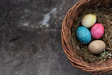 Easter eggs lie on the background, space for text