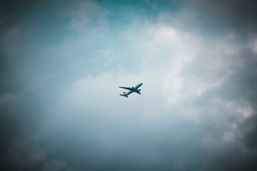 Low angle shot of a plate silhouette flying in a clear sky