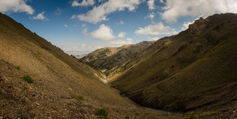 Ascent through a valley to the Aktash Pass in the Turkestan Mountains in Kyrgyzstan.
