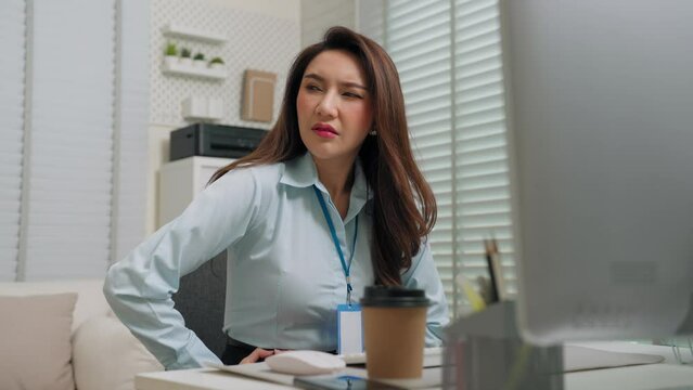 Young Asian businesswoman having menstrual pain