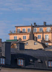 Old apartment houses on the cliff Mariaberget with towers and dorms, a sunny spring morning in Stockholm 
