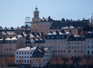 Obraz premium Old apartment houses on the cliff Mariaberget, a sunny spring day in Stockholm