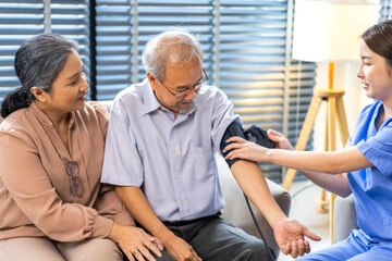 Obraz premium Portrait of smiling caring asian nurse service help support discussing and consulting taking care with senior elderly asian man and woman couple at home visit.senior retirement home care concept