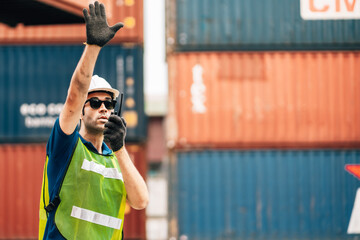 Logistics, shipping and construction worker using walkie talkie in shipyard. Transportation...