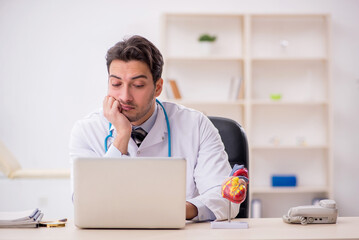 Young male doctor in telemedicine concept