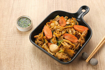 Kwetiaw or Kwetiau, fried rice noodles with meatballs and vegetables. Popular in Indonesia
