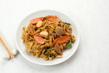 Kwetiaw or Kwetiau, fried rice noodles with meatballs and vegetables. Popular in Indonesia
