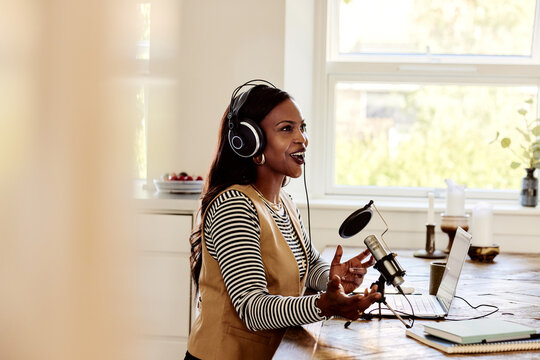Woman doing a podcast at home