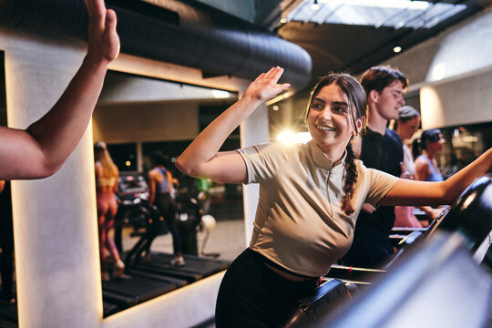 Woman high-fiving an exercise partner