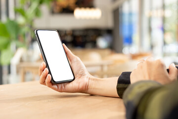 cell phone blank white screen mockup.hand holding texting using mobile on desk at office.background empty space for advertise.work people contact marketing business,technology