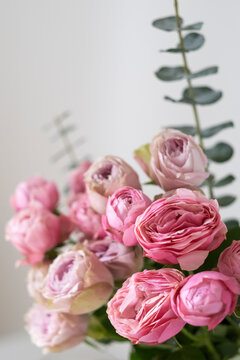 Beautiful bouquet with pink roses and eucalyptus and copy space