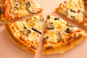 Sliced pizza with arugula and cheese on pink background. slice top view. Italian traditional food.