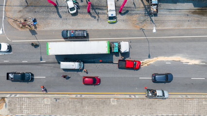 Two cars accident on the Road. Top view shot of two crushed cars on the road. Cars go around the scene of an accident. Car Crash Traffic Accident Scene. - obrazy, fototapety, plakaty