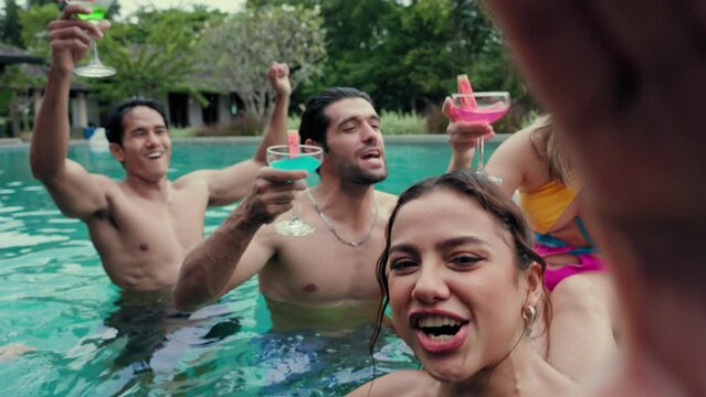 Groups of Multiculturalism Friends make a selfie having fun in pool party and enjoying outdoors travel holiday vacation trip at private pool villa