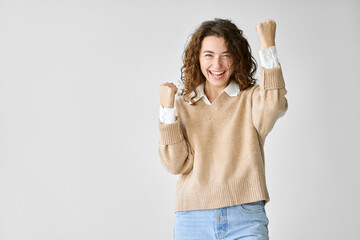 Young happy lucky overjoyed woman model student feeling excited winner raising fists in yes gesture...