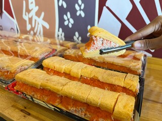 Fototapeta premium Sweet Egg Sandwich The filling is made from crab stick salad topped with flying Fish.