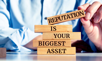 Close up on businessman holding a wooden block with 