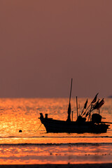 Fishing boat on sunset
