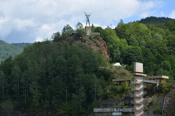 Lake Vidraru  is an artificial lake in Romania. It was created in 1965 by the construction of the Vidraru Dam on the Argeș River. Statue 'Energia', representing Prometheus with lightnings in his hand, © Elena