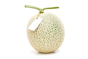 Green melon with white tag on white background. Fruit and nature food background