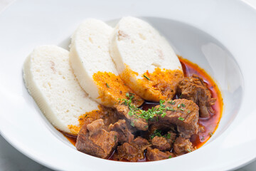 beef goulash served with dumplings
