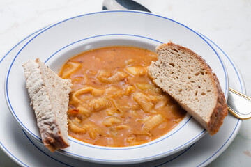 onion soup served with slice of bread