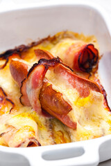wurst in bacon baked with chedar cheese