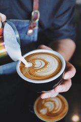 person holding a cup of coffee