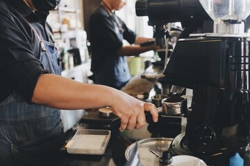 man working on a coffee machine