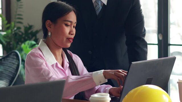 Architect and contractor team working meeting. Business people and real estate agent brokers company meeting and discussion plan on laptop computer at workplace