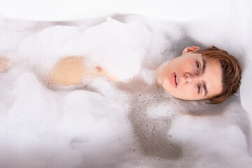 Relax and rest. Young attractive guy in the bath.