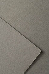 Rough kraft paper pieces background, geometric monochrome paper texture gray color. Mockup with copy space for text