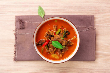 Beef curry, beef panang recipe. Thai food, young coconut milk curry Placed on a wooden table - top view