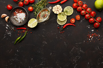 Frame composition of various vegetables, herbs and spices on dark concrete background. Top view...