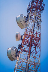 5G Cell Towers for smart mobile telephone on sky background
