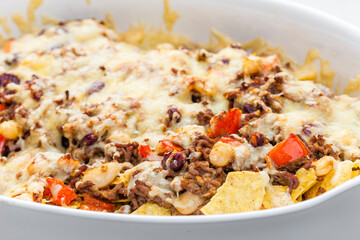 nachos with minced beef , red pepper and beans